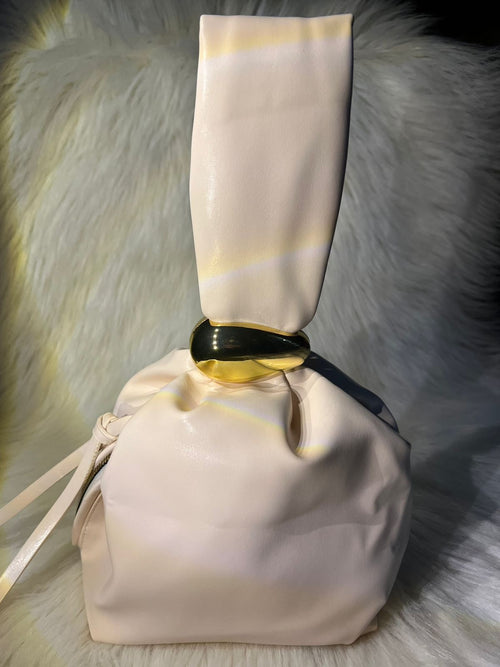 Golden charm handbag