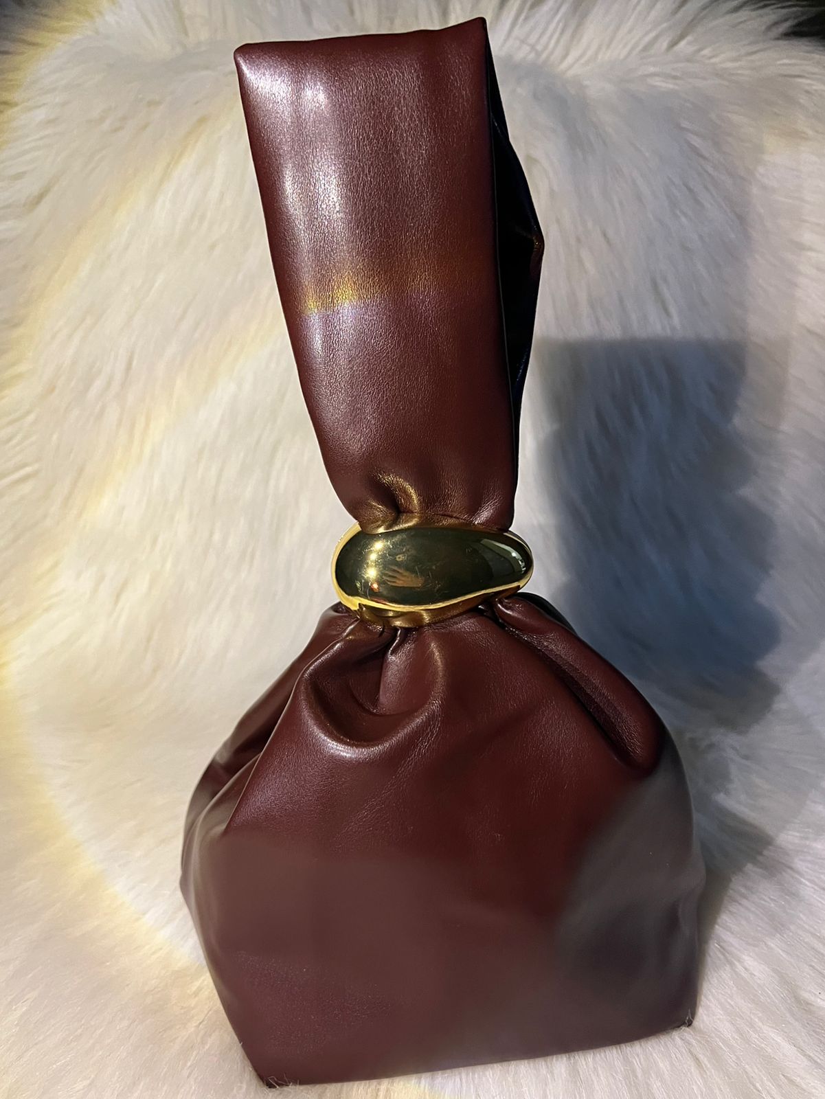 Golden charm handbag